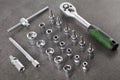 Ratchet set with heads, different socket wrenches close-up on a dark stone Royalty Free Stock Photo