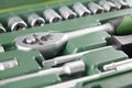 Ratchet set with heads, different socket wrenches close-up in a green plastic case Royalty Free Stock Photo