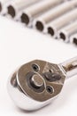 Ratchet with sockets blurred background Royalty Free Stock Photo