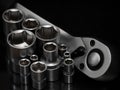 Ratchet wrench. Set of stainless steel hex sockets on shiny black surface. Universal professional tool for car repair. Low key Royalty Free Stock Photo