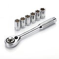 Ratchet wrench with six socket attachments on a white background socket wrench tool Royalty Free Stock Photo