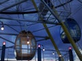 A rather large and colorful scene or cage of a ferris wheel when night is coming.