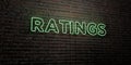 RATINGS -Realistic Neon Sign on Brick Wall background - 3D rendered royalty free stock image