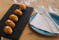 Ration of croquettes on a black table