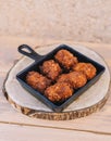 Ration of typical Spanish croquettes stuffed with chicken and seafood