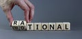 Rational or emotional symbol. Psychologist turns wooden cubes and changed the word `rational` to `emotional`. Beautiful grey Royalty Free Stock Photo