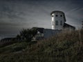 Rationalist house in a coastal town at sunset