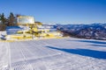 Ratrak, grooming machine, special snow vehicle over valley with beautiful nature in background