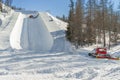 Ratrak making half pipe slope for snowboard and ski