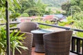 Rattan armchair and table on mountain view terrace Royalty Free Stock Photo