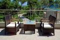 Rattan armchairs on resort terrace lounge . Royalty Free Stock Photo