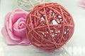 Rattan ball and flower on white Royalty Free Stock Photo