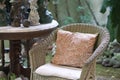 Rattan chair with flower pattern cushion Royalty Free Stock Photo