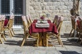 Rattan chairs and table in a street restaurant Royalty Free Stock Photo