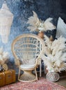 Rattan peacock chair in loft room with boho decorations