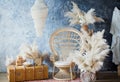 Rattan peacock chair in loft room with boho decorations