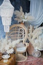 Rattan peacock chair in loft room with boho decorations