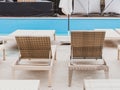 Rattan reclining chaise. Comfortable outdoor patio wicker chaise lounges. Swimming pool backyard resort furniture Royalty Free Stock Photo