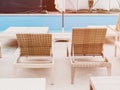 Rattan reclining chaise. Comfortable outdoor patio wicker chaise lounges. Swimming pool backyard resort furniture Royalty Free Stock Photo