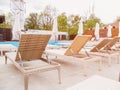 Rattan reclining chaise. Comfortable outdoor patio wicker chaise lounges. Swimming pool backyard resort furniture Royalty Free Stock Photo