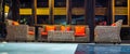 Rattan sofa with orange cushion in the lobby of a hotel Royalty Free Stock Photo