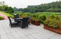 Rattan sofa and table set in a garden Royalty Free Stock Photo