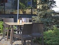 rattan table and chairs on the summer terrace of a street cafe Royalty Free Stock Photo