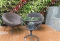 rattan wicker chair and desk on patio Royalty Free Stock Photo