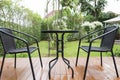 rattan wicker chair and desk on patio Royalty Free Stock Photo