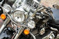Ratzeburg, Germany, July 31, 2022: Part of a Harley Davidson motorcycle from the front with headlights, orange lamps and chrome,