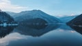 Rausor lake and Iezer Papusa Mountain in winter Royalty Free Stock Photo