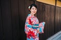 Raveler with kimono standing in city in Japan