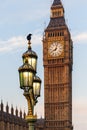 Raven on lampost at Houses of Parliament in early winter morning