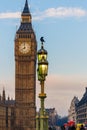 Raven on lampost at Houses of Parliament in early winter morning