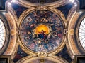 Ceiling of a cathedral chapel painted with the image of the Virgin Mary surrounded by the angels of paradise.