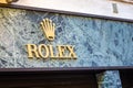 light is enlightening ROLEX logo on storefront