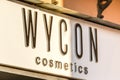 light is enlightening WYCON COSMETICS logo on storefront