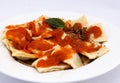Ravioli with a delicious bolognese sauce, topped with fresh basil