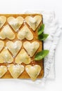 ravioli in a heart shape. cutting board with a group of raw freshly homemade ravioli . ready to be cooked. food romantic Royalty Free Stock Photo