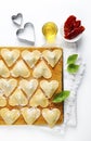 ravioli in a heart shape. cutting board with a group of raw freshly homemade ravioli . ready to be cooked. food romantic Royalty Free Stock Photo