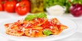 Ravioli pasta meal from Italy for lunch dish with tomato sauce on a plate panorama