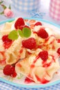 Ravioli (pierogi) with cheese and raspberry Royalty Free Stock Photo