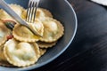 Ravioli with ricotta cheese, yolks quail eggs and spinach with spices. Royalty Free Stock Photo