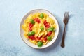 Ravioli with tomato sauce and basil on a plate, overhead shot with a fork Royalty Free Stock Photo