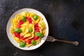 Ravioli with tomato sauce and basil on a plate, top shot with a fork Royalty Free Stock Photo