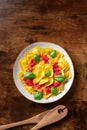 Ravioli with tomato sauce and fresh basil leaves, overhead shot. Italian recipe Royalty Free Stock Photo