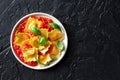 Ravioli with tomato sauce and fresh basil leaves on a plate, Italian pasta dish Royalty Free Stock Photo