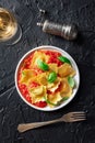 Ravioli with tomato sauce and fresh basil leaves on a plate, Italian pasta dish Royalty Free Stock Photo