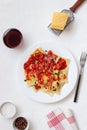 Ravioli with tomato sauce, spinach and parmesan cheese. Healthy eating. Vegetarian food. Italian cuisine Royalty Free Stock Photo