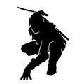 Silhouette of a warrior male in action pose with swords weapon. Royalty Free Stock Photo